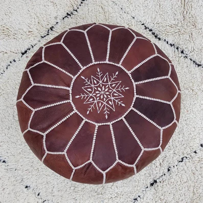 Moroccan Leather Pouf — color variation in natural light