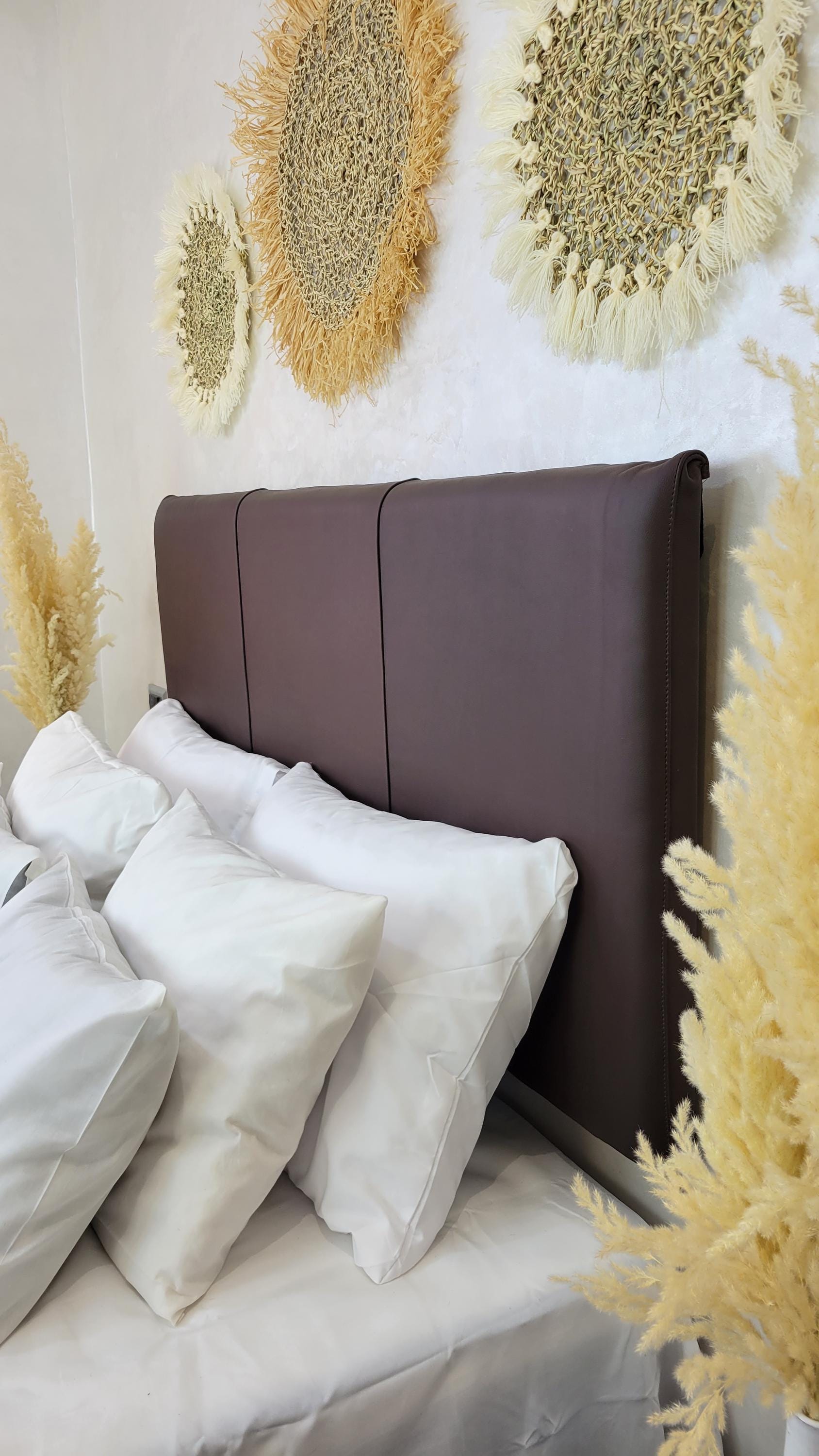 Upholstered Leather Headboard — styled in a modern boho living room