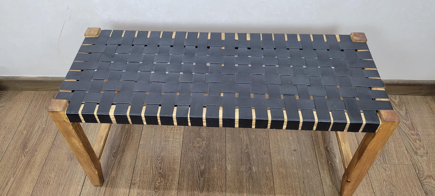 Woven Leather Bench — side view of artisan stitching
