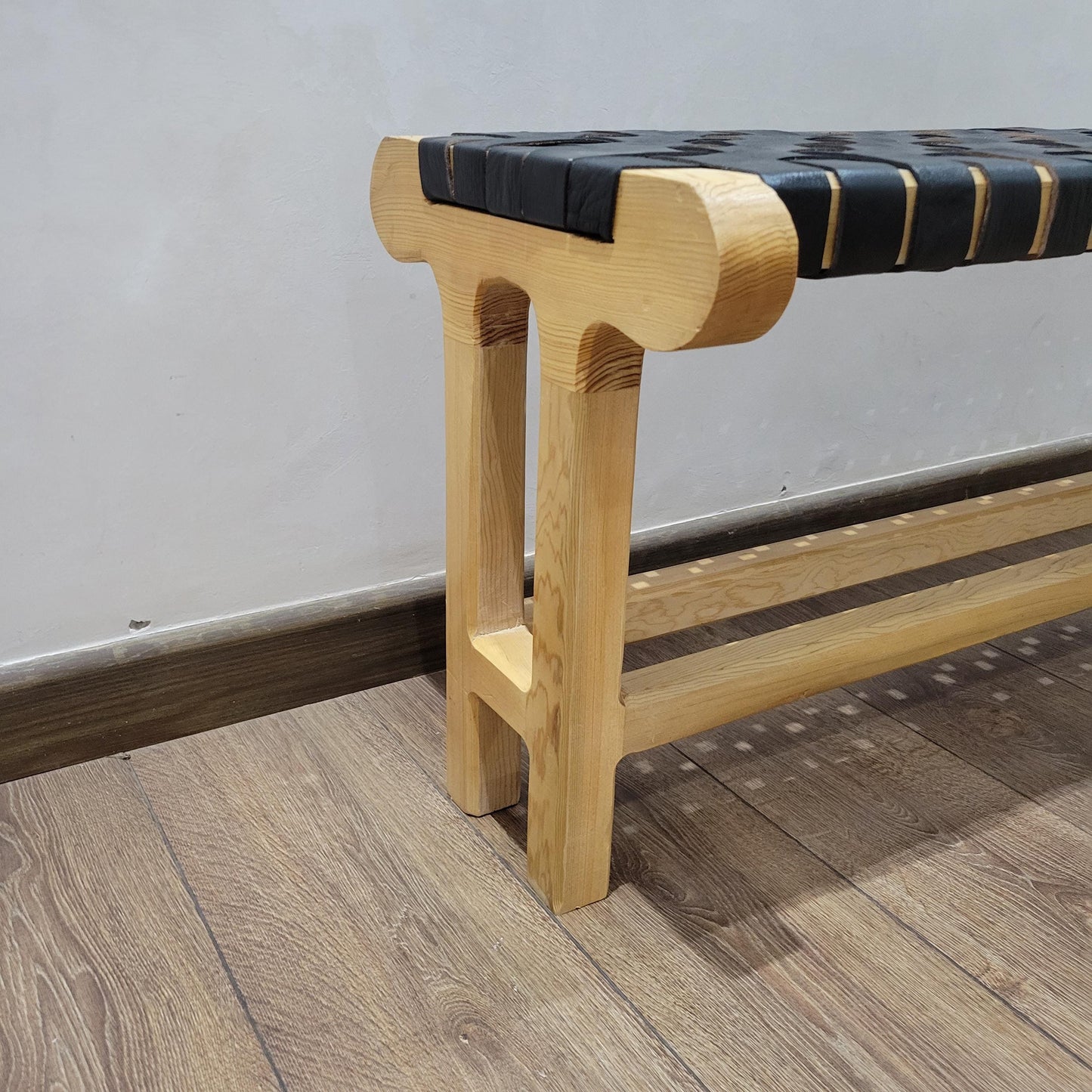 Woven Leather Bench — top view showing weave pattern