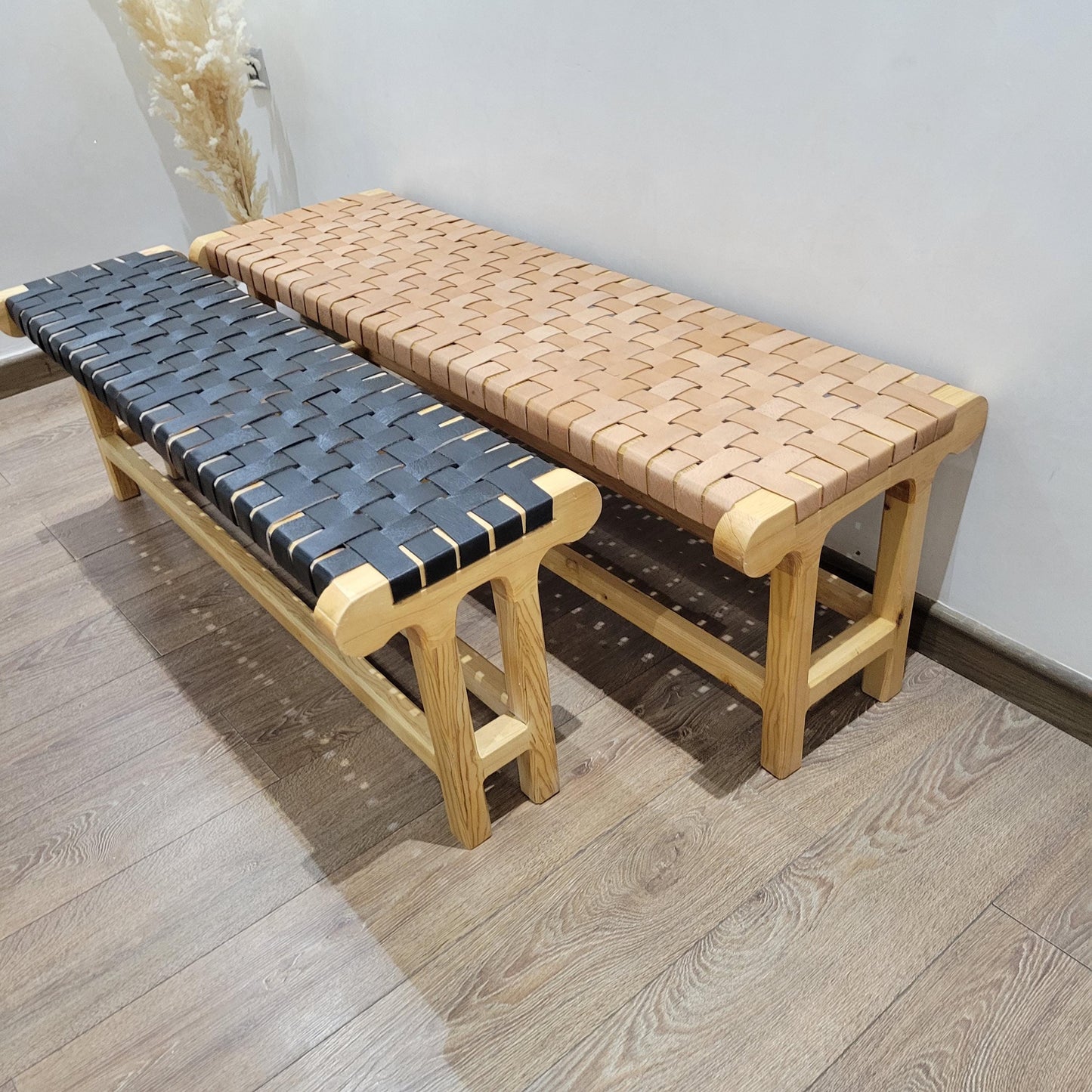 Woven Leather Bench — side view of artisan stitching
