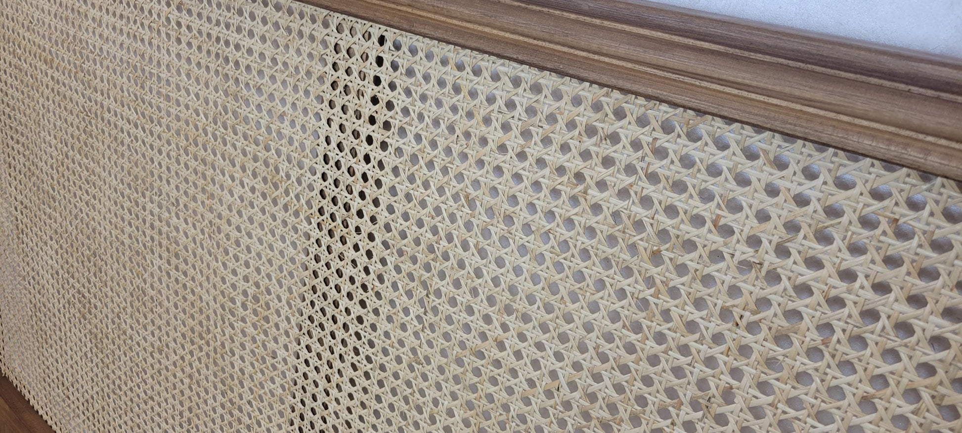 Rattan Headboard — color variation in natural light