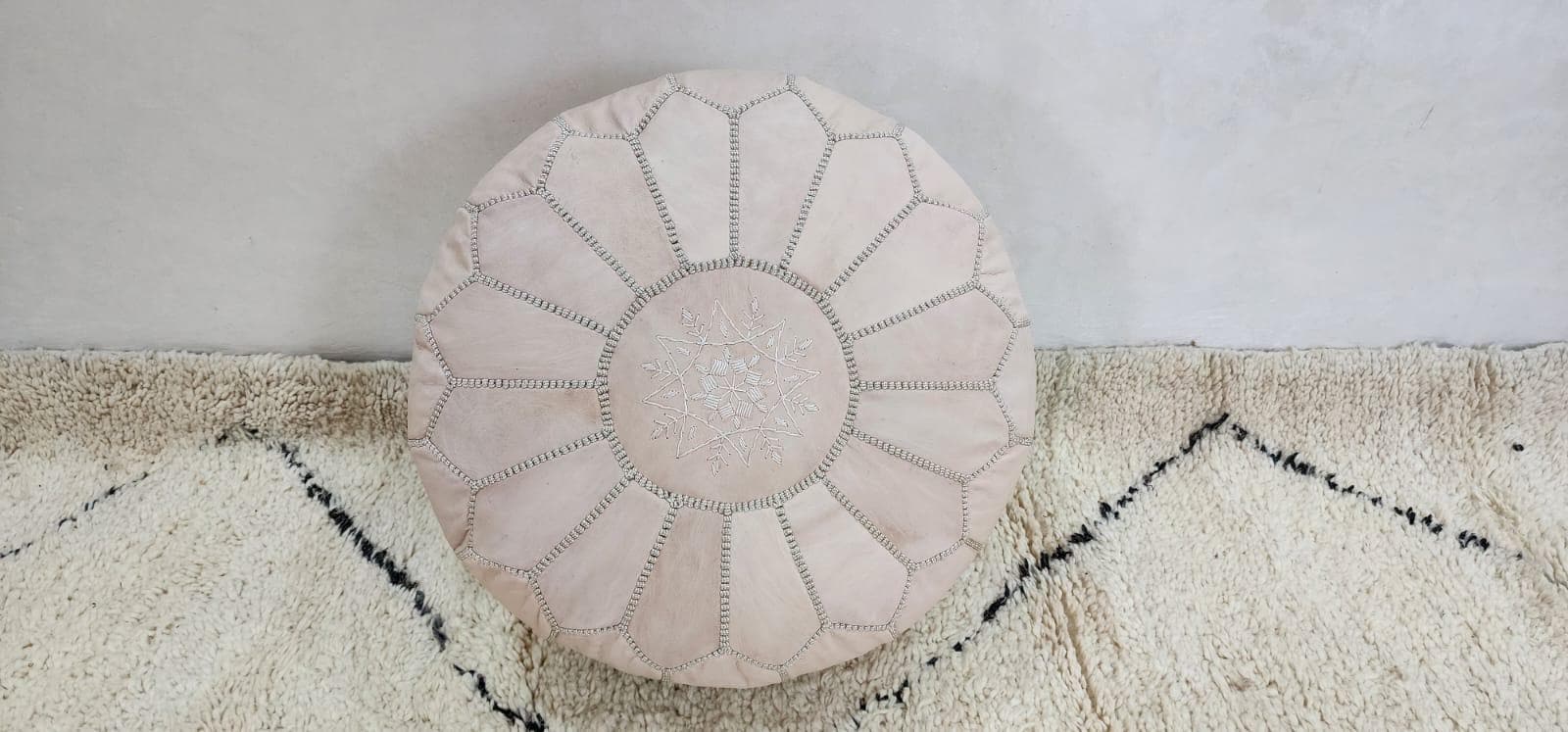 Knit Pouf Ottoman — side view of artisan stitching