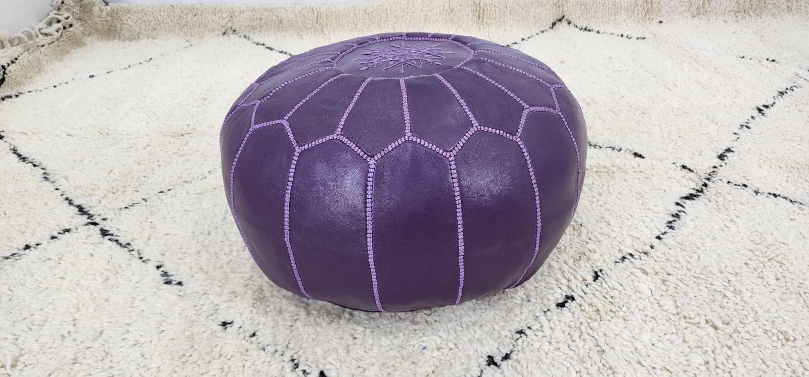Moroccan Leather Pouf — styled in a modern boho living room