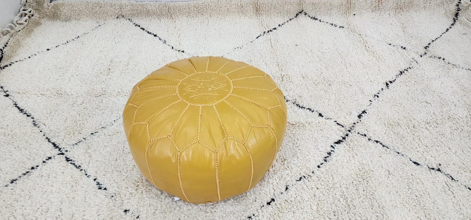 Moroccan Leather Pouf — side view of artisan stitching