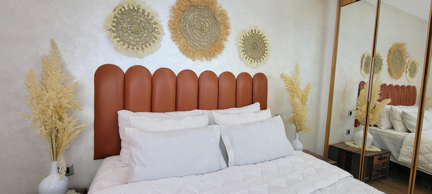 Upholstered Leather Headboard — side view of artisan stitching