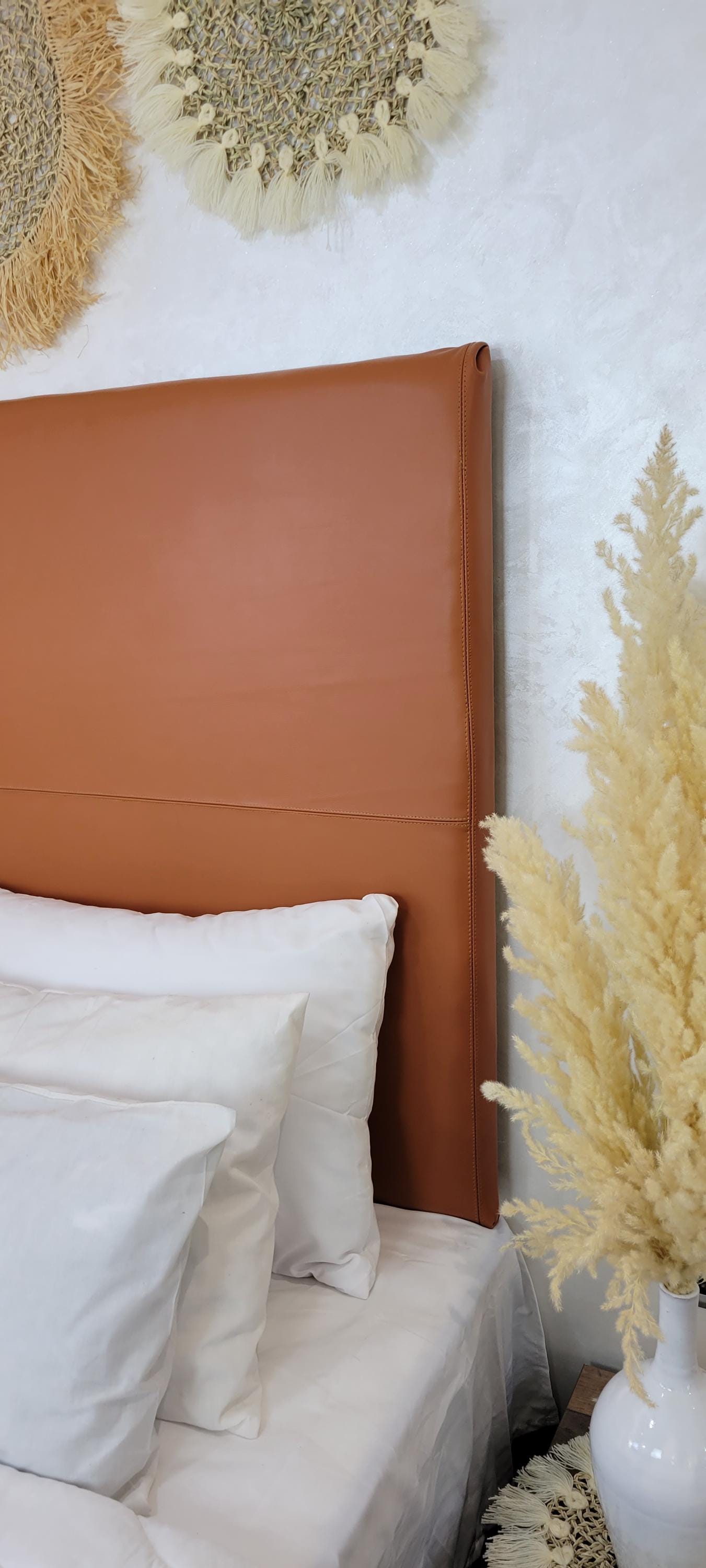 Upholstered Leather Headboard — side view of artisan stitching