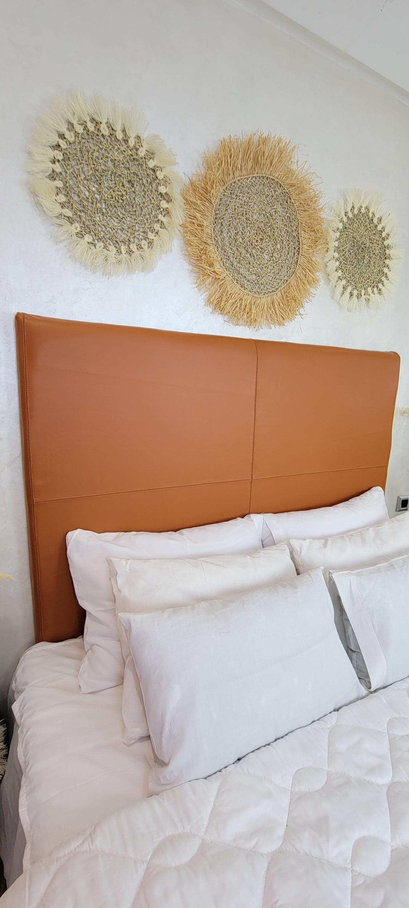 Upholstered Leather Headboard — styled in a modern boho living room
