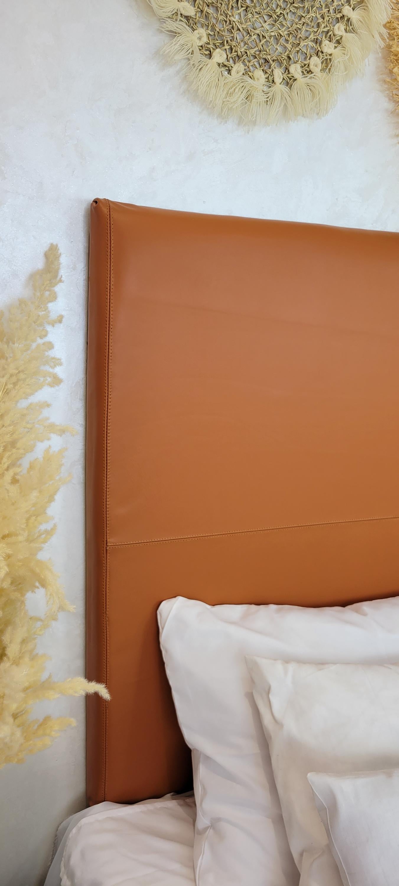 Upholstered Leather Headboard — color variation in natural light