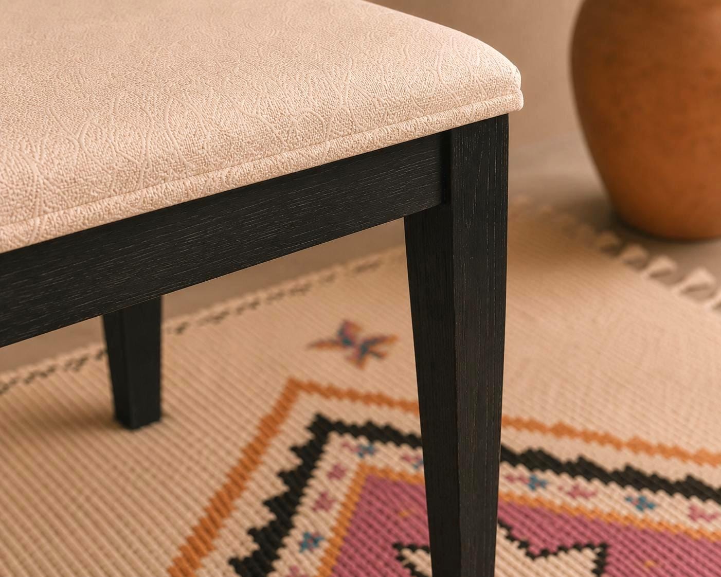 Moroccan Fabric Bench — side view of artisan stitching