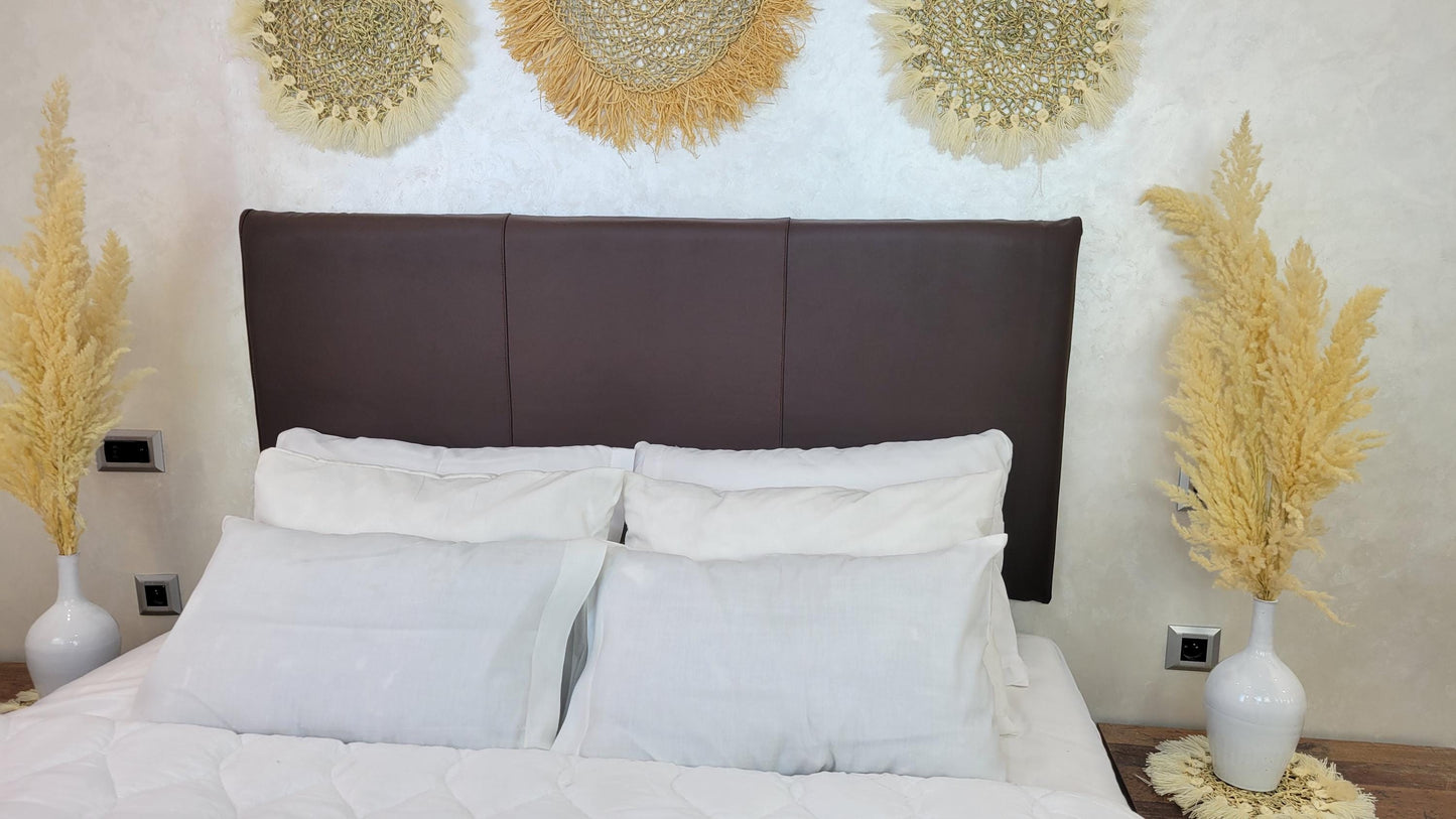 Upholstered Leather Headboard — side view of artisan stitching