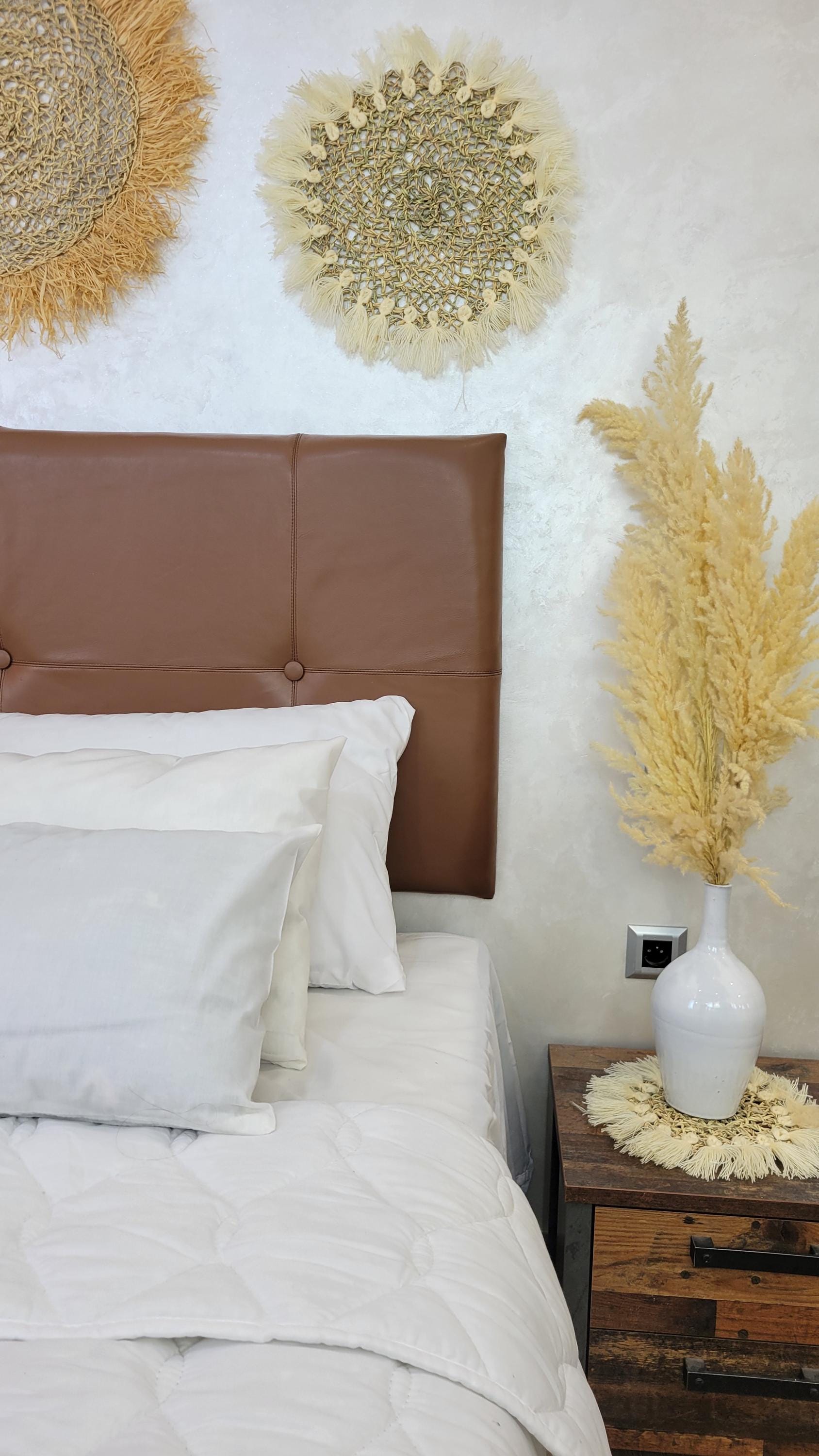 Upholstered Leather Headboard — side view of artisan stitching