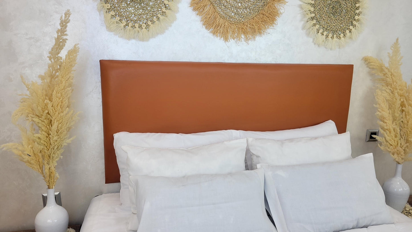 Upholstered Leather Headboard — side view of artisan stitching