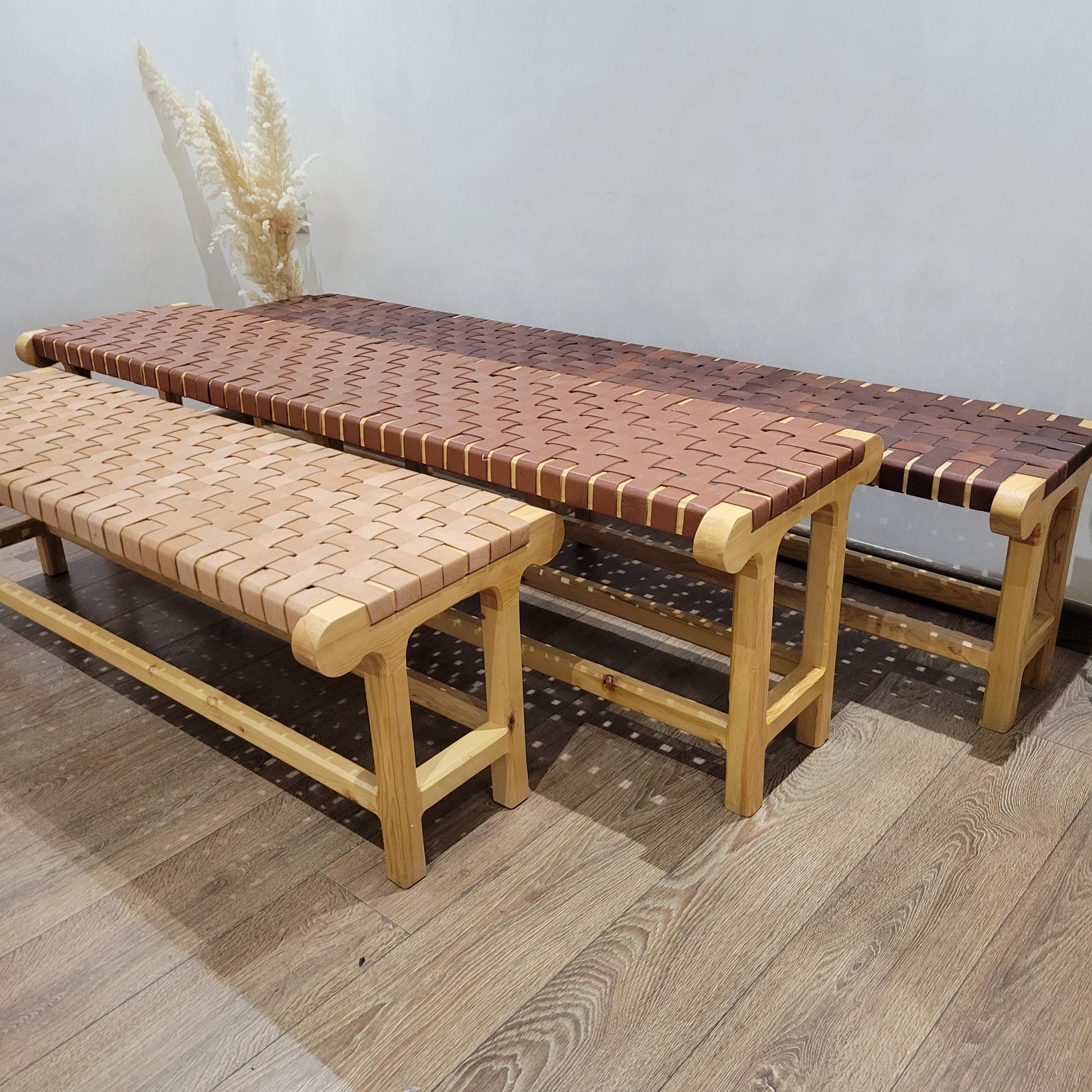 Woven Leather Bench — side view of artisan stitching