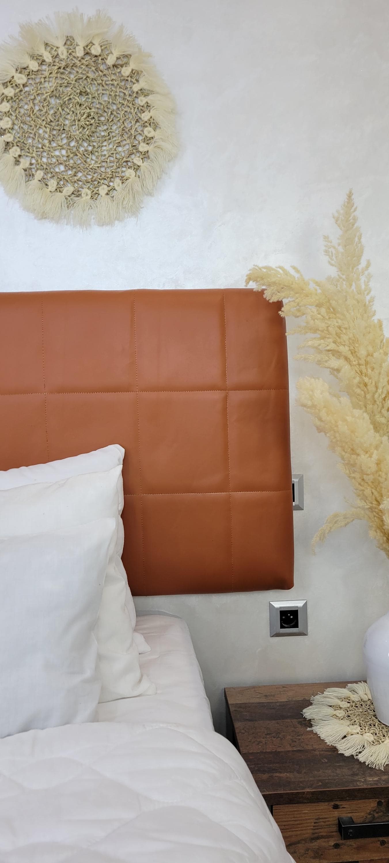 Upholstered Leather Headboard — color variation in natural light