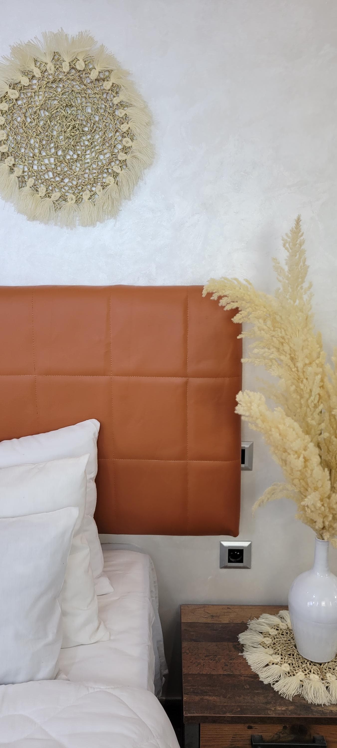 Upholstered Leather Headboard — side view of artisan stitching